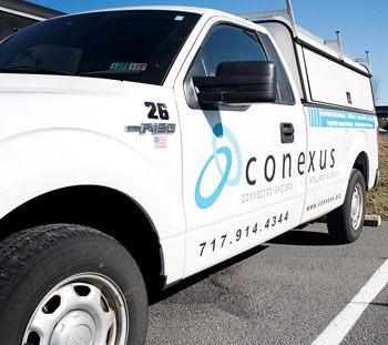 White truck with Conexus branding
