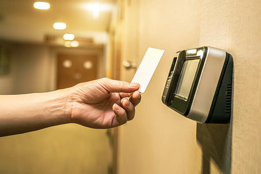 Man using security card on access control system