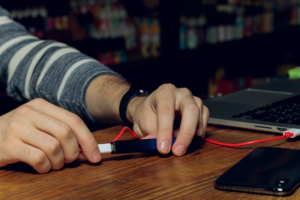 a student charges their vape pen through their school laptop