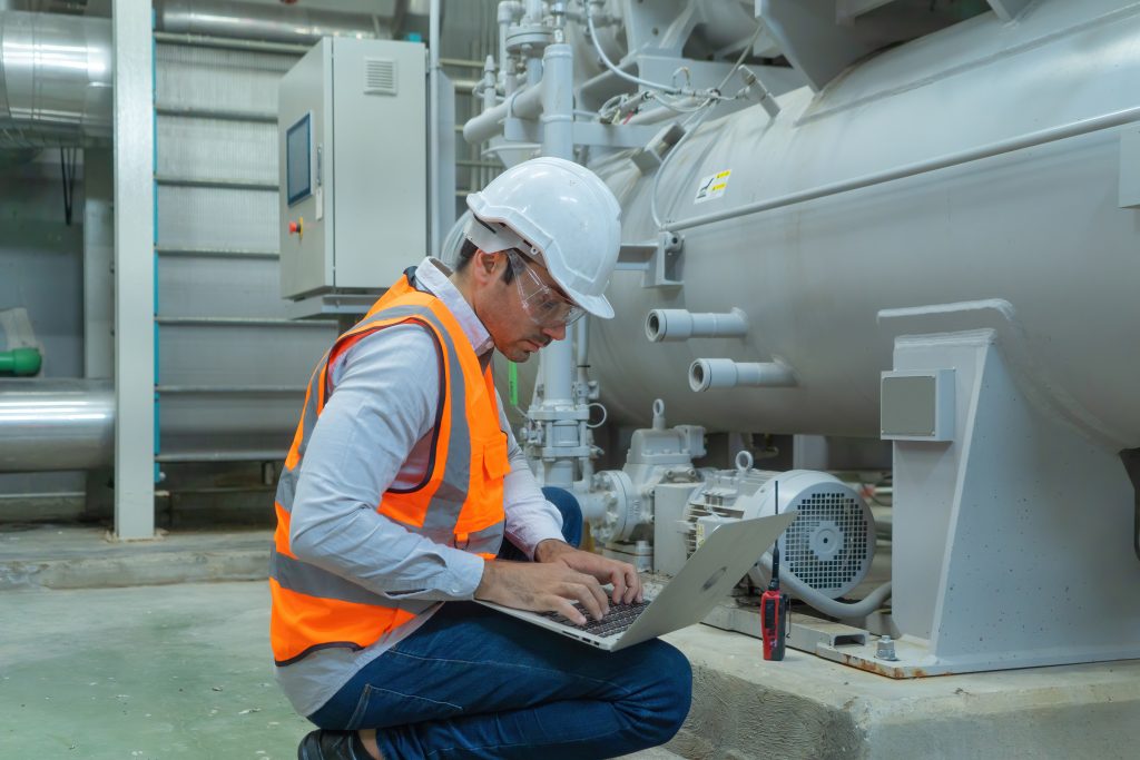 A Master Systems Integration engineer optimizing HVAC equipment in a building.